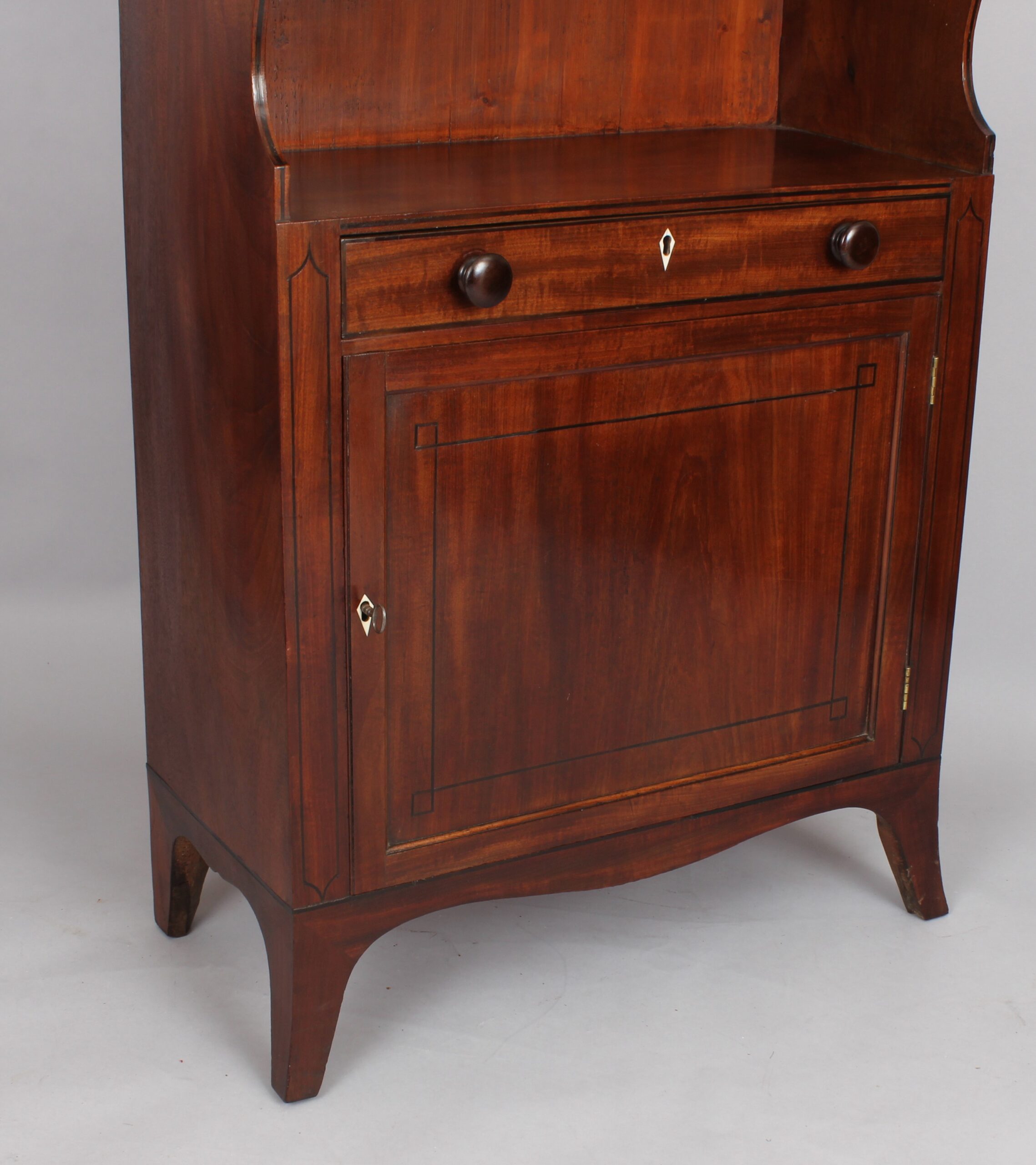 George III period mahogany cupboard base water fall bookshelves