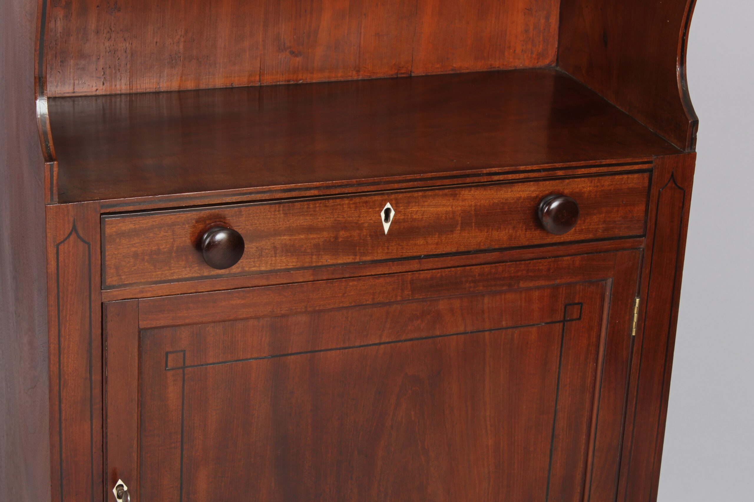 George III period mahogany cupboard base water fall bookshelves
