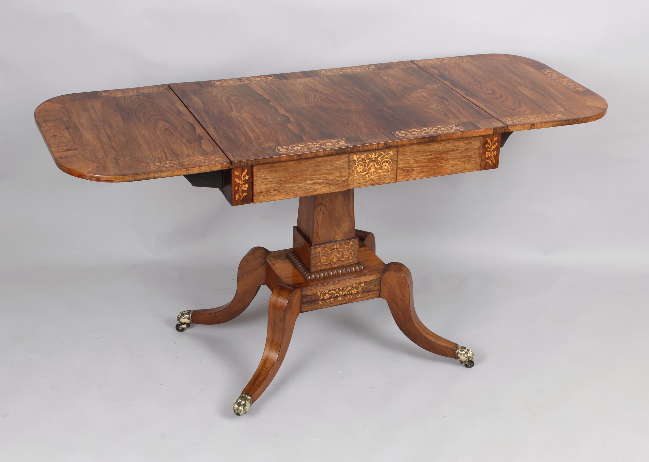 A fine Regency period sofa table of unusually small proportions