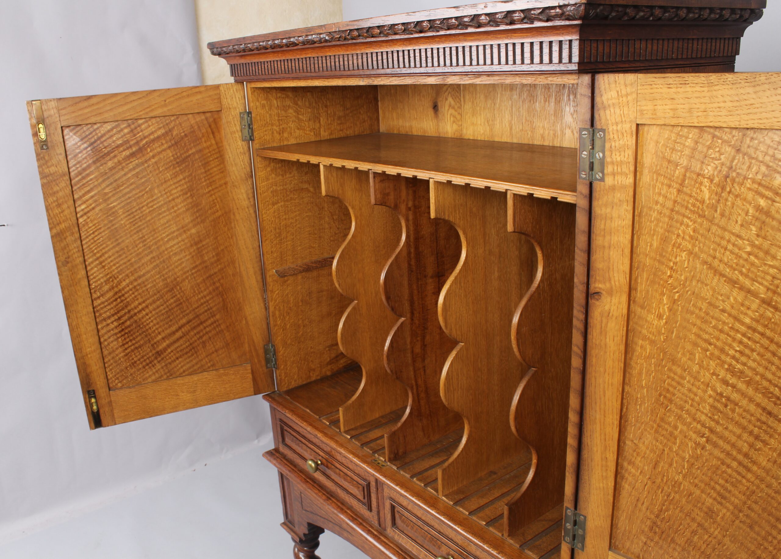 An Edwardian oak stationery cabinet