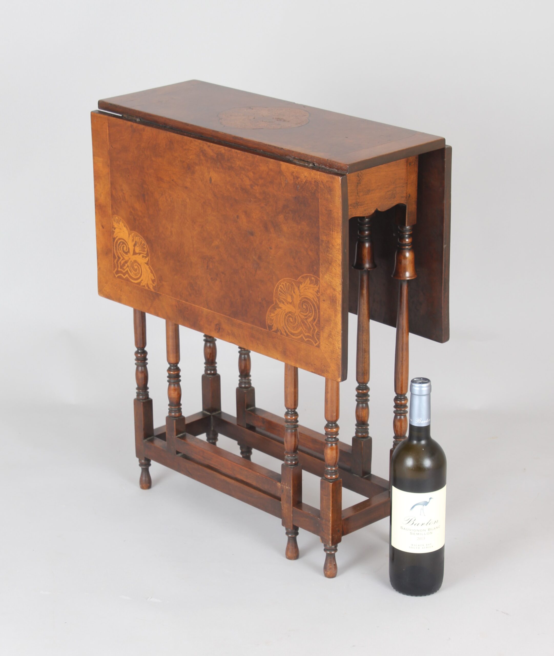 Edwardian burr walnut and parquetry Sutherland table of rare form