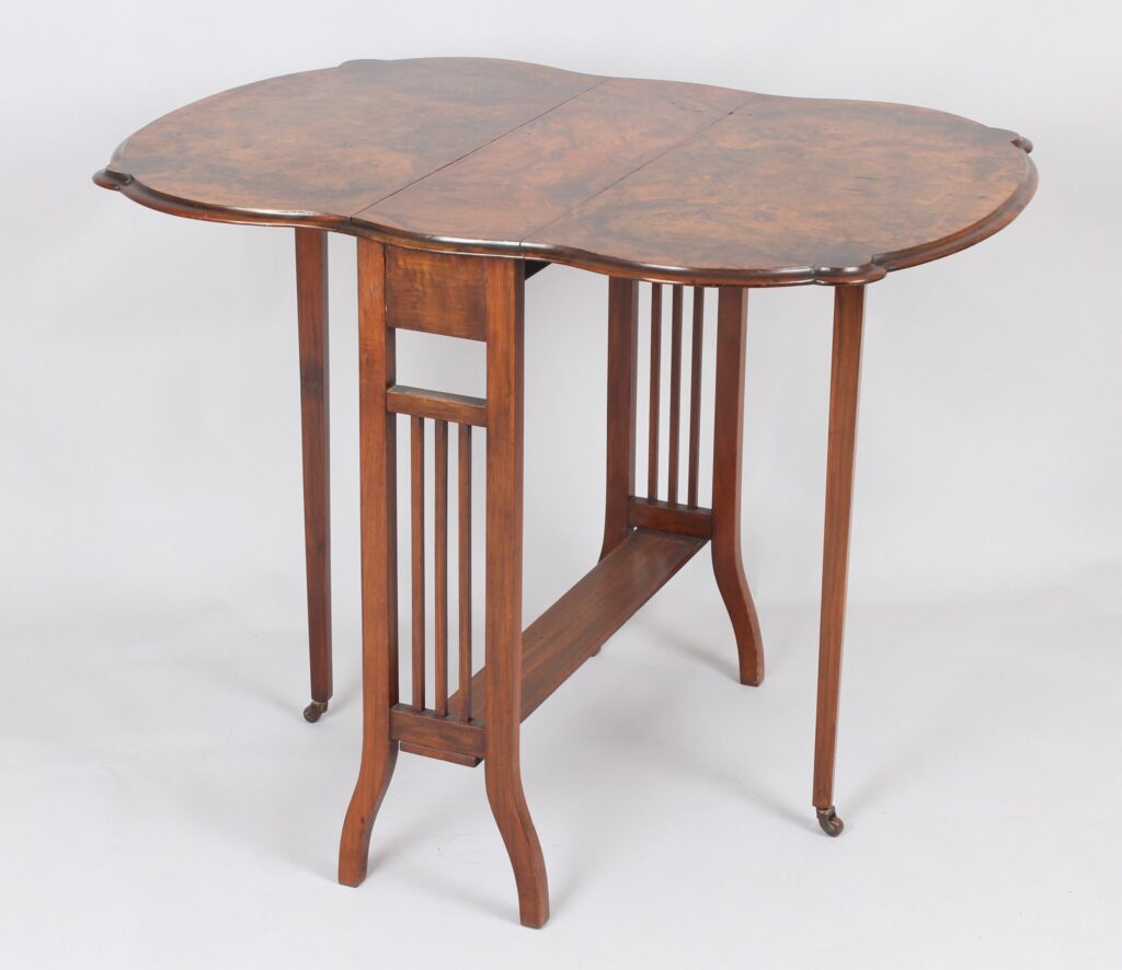 A fine Edwardian walnut Sutherland table