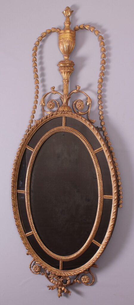 A George III period carved and gilt wood mirror