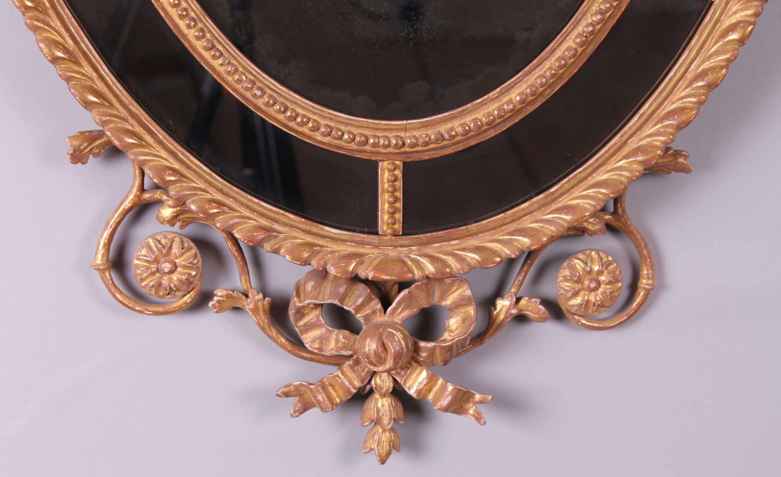 A George III period carved and gilt wood mirror