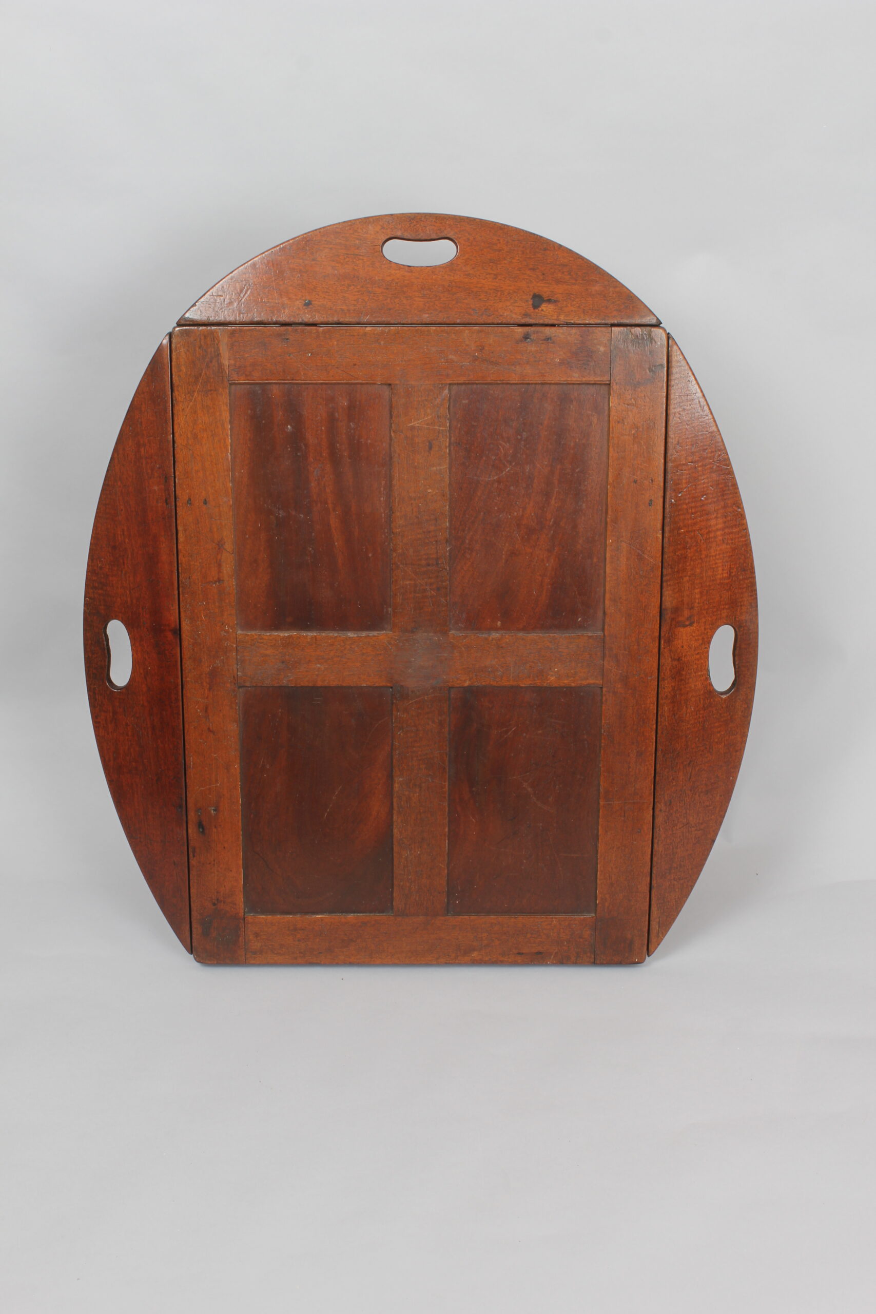 A nineteenth century mahogany oval drop-side Butler’s tray and stand