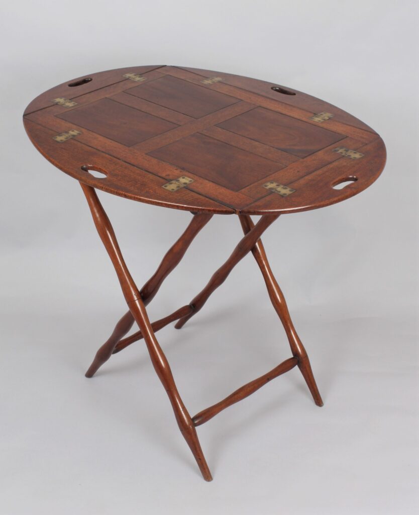 A nineteenth century mahogany oval drop-side Butler’s tray and stand