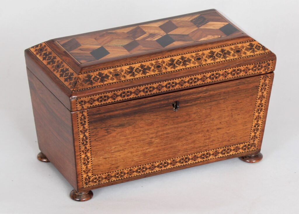 Rosewood tea caddy of sarcophagus form