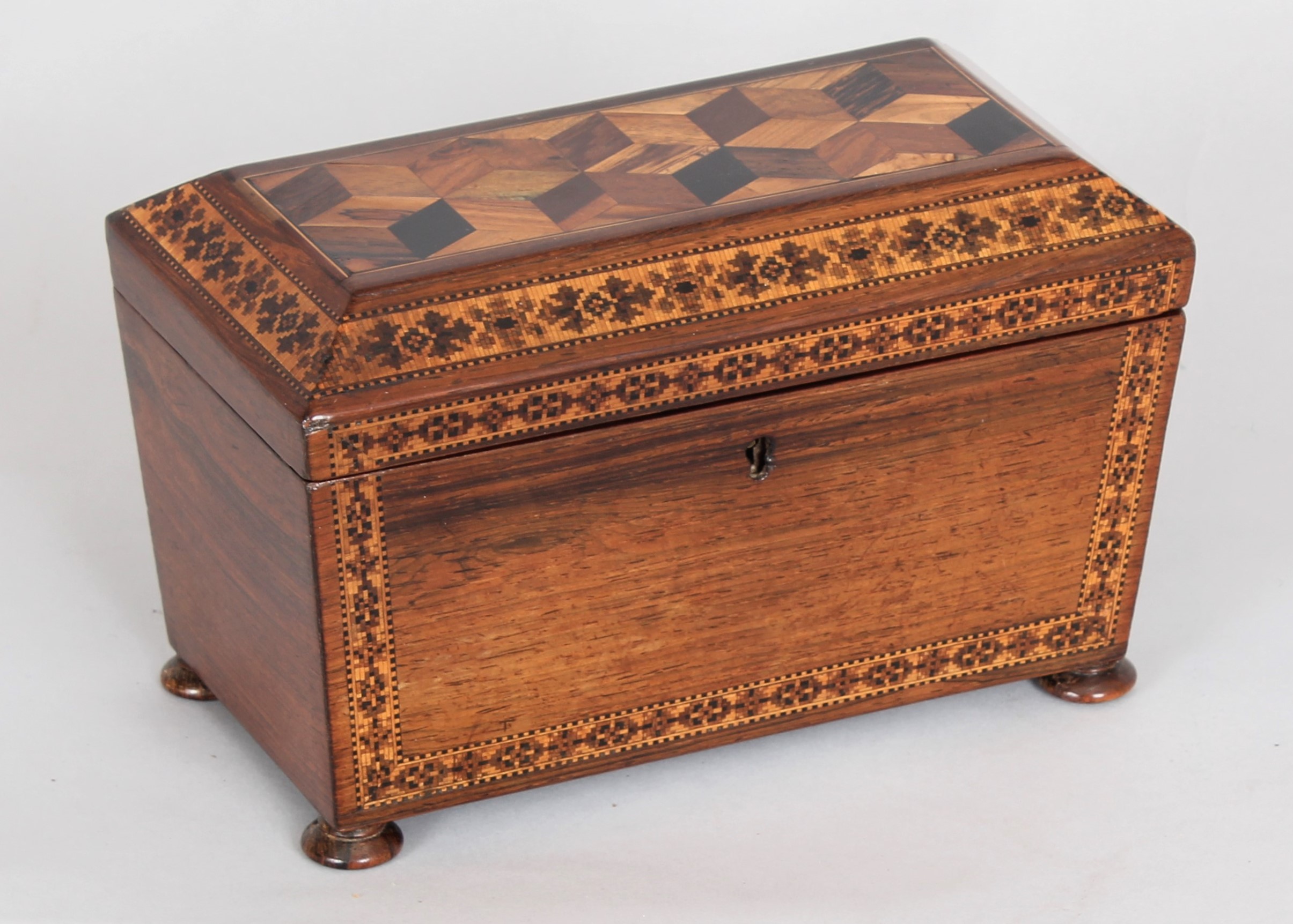Rosewood tea caddy of sarcophagus form