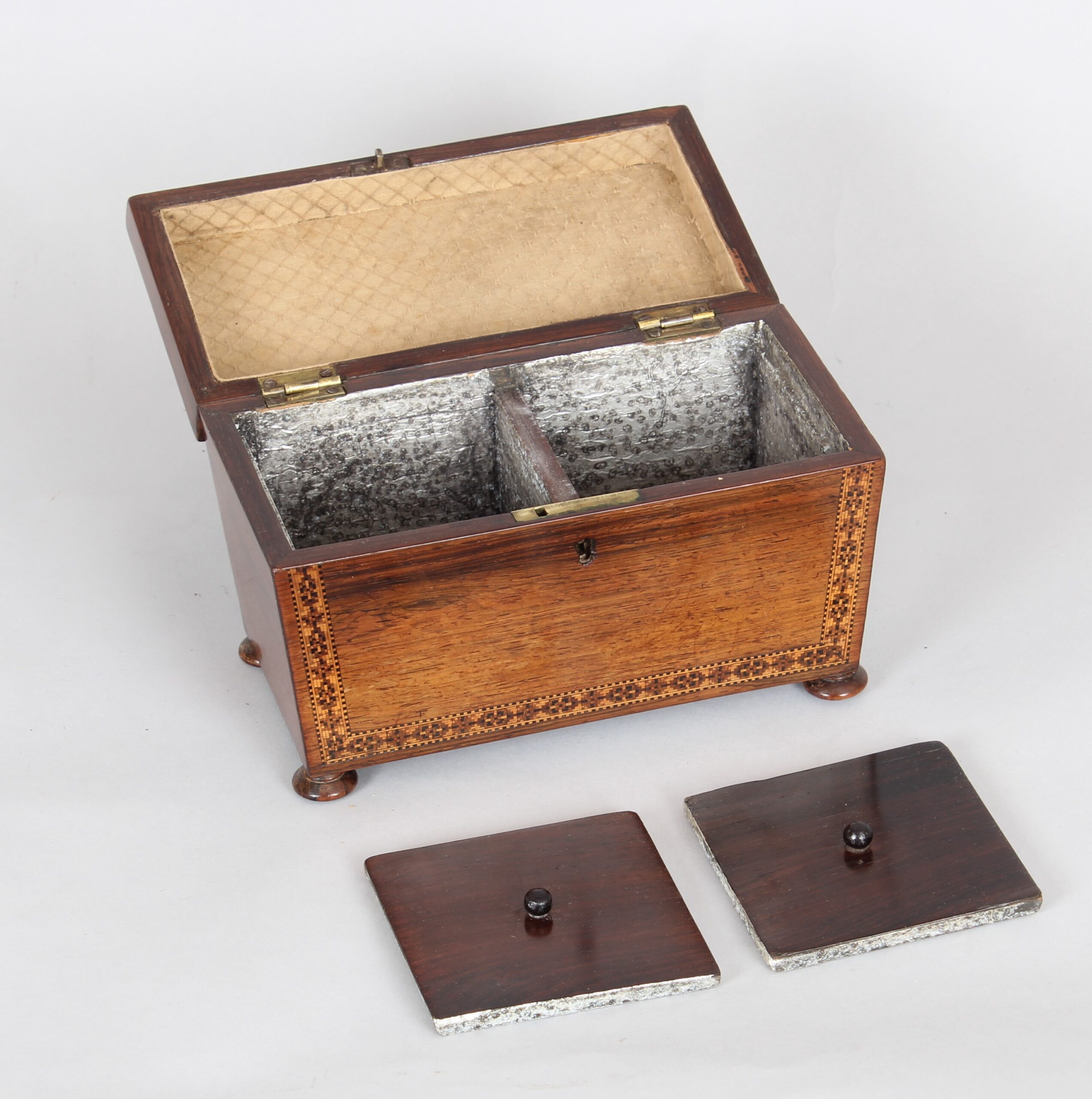 Rosewood tea caddy of sarcophagus form