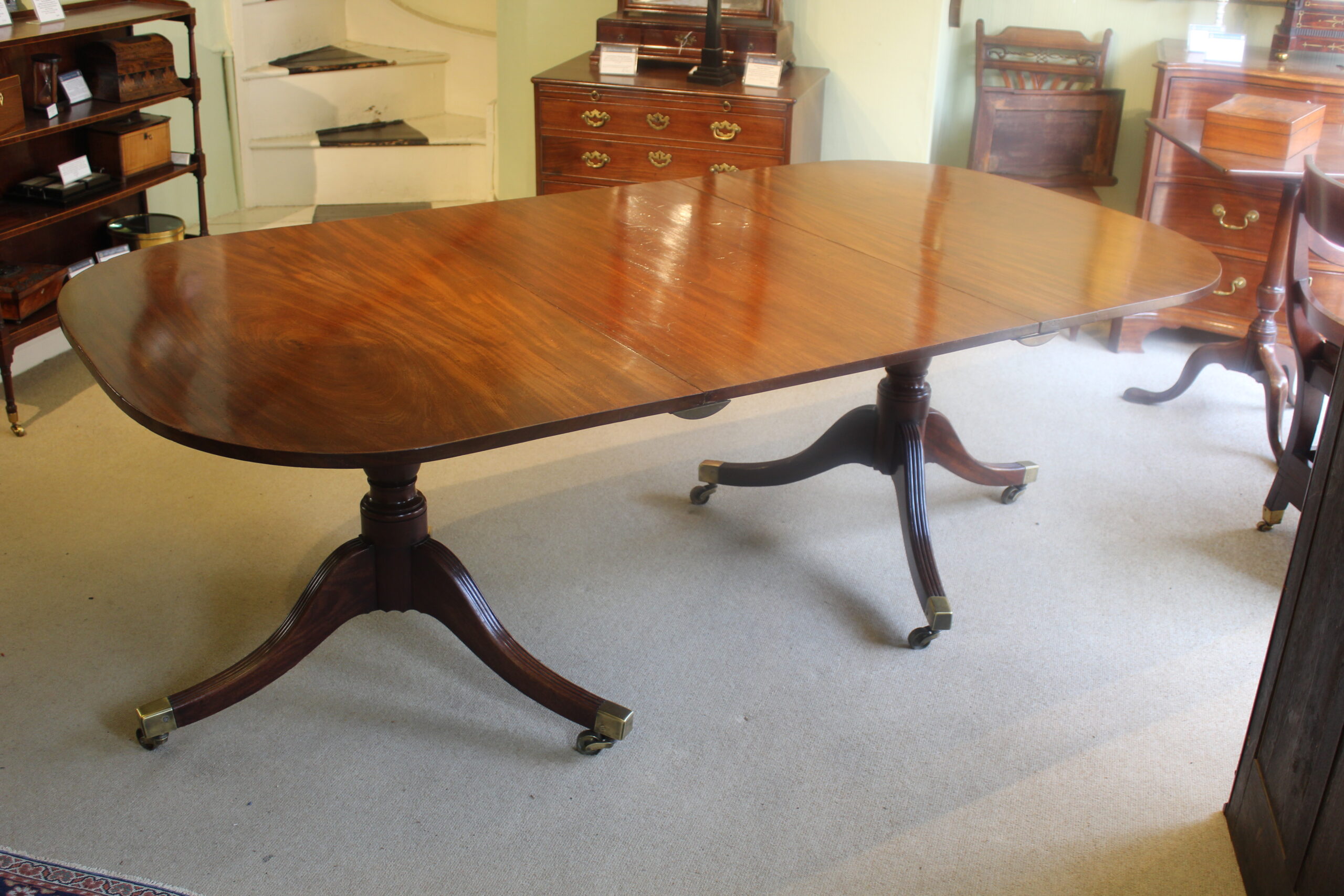 Early 19th century mahogany two-pillar dining table
