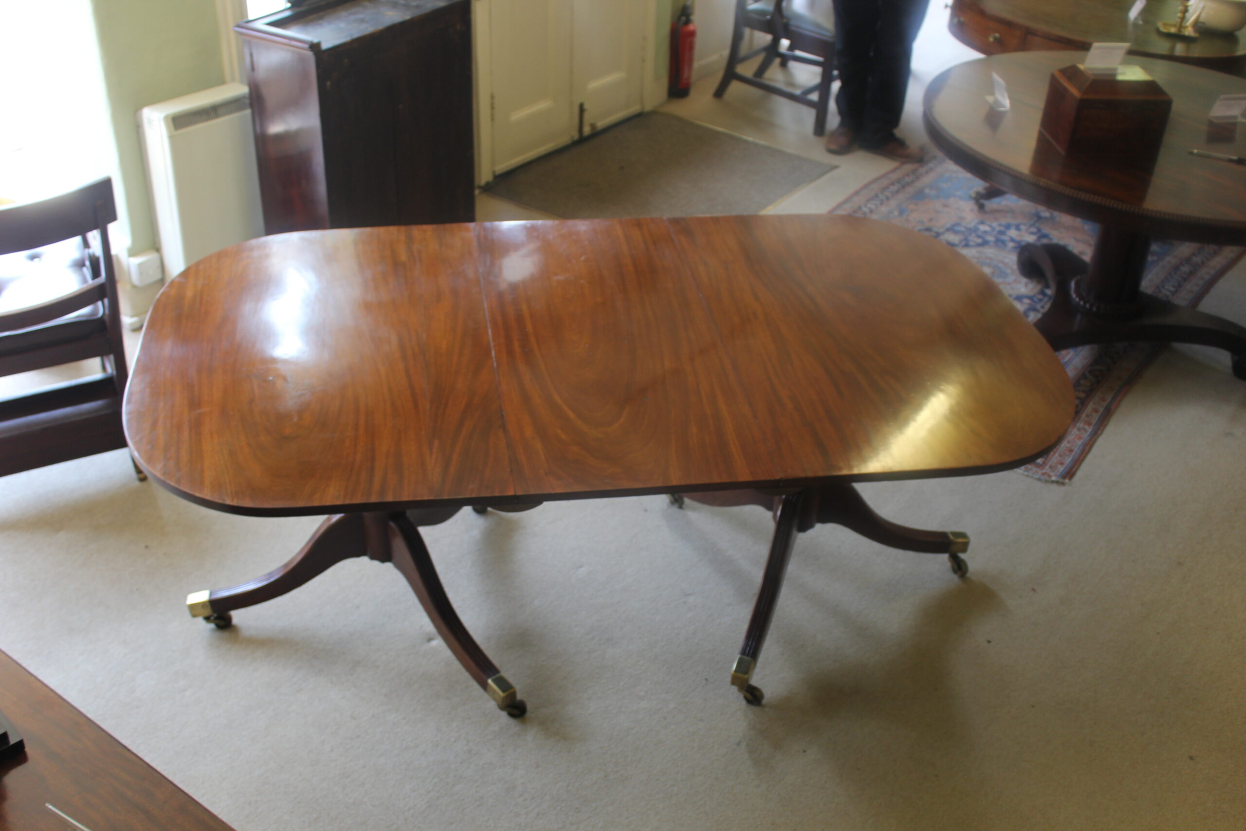 Early 19th century mahogany two-pillar dining table