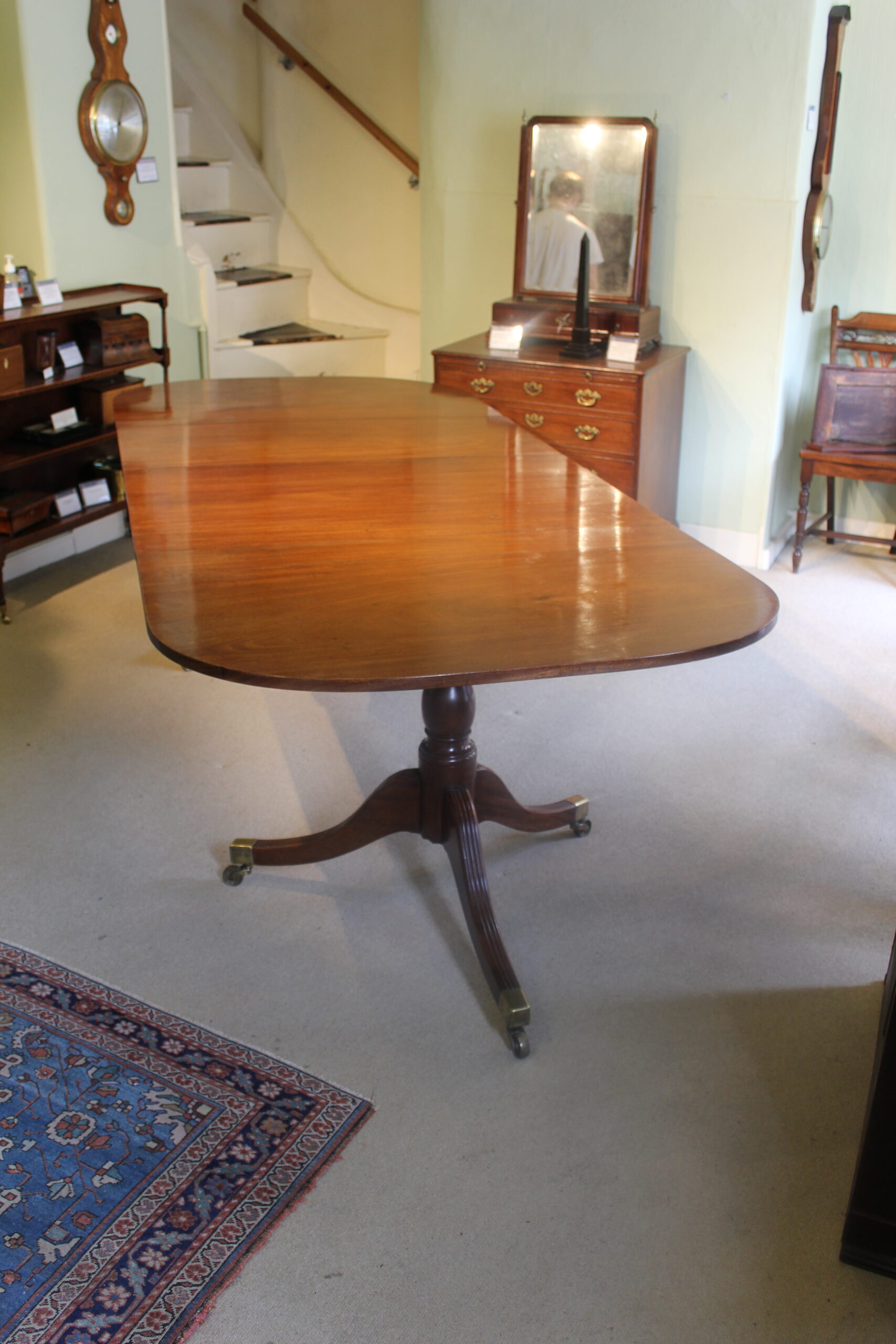 Early 19th century mahogany two-pillar dining table