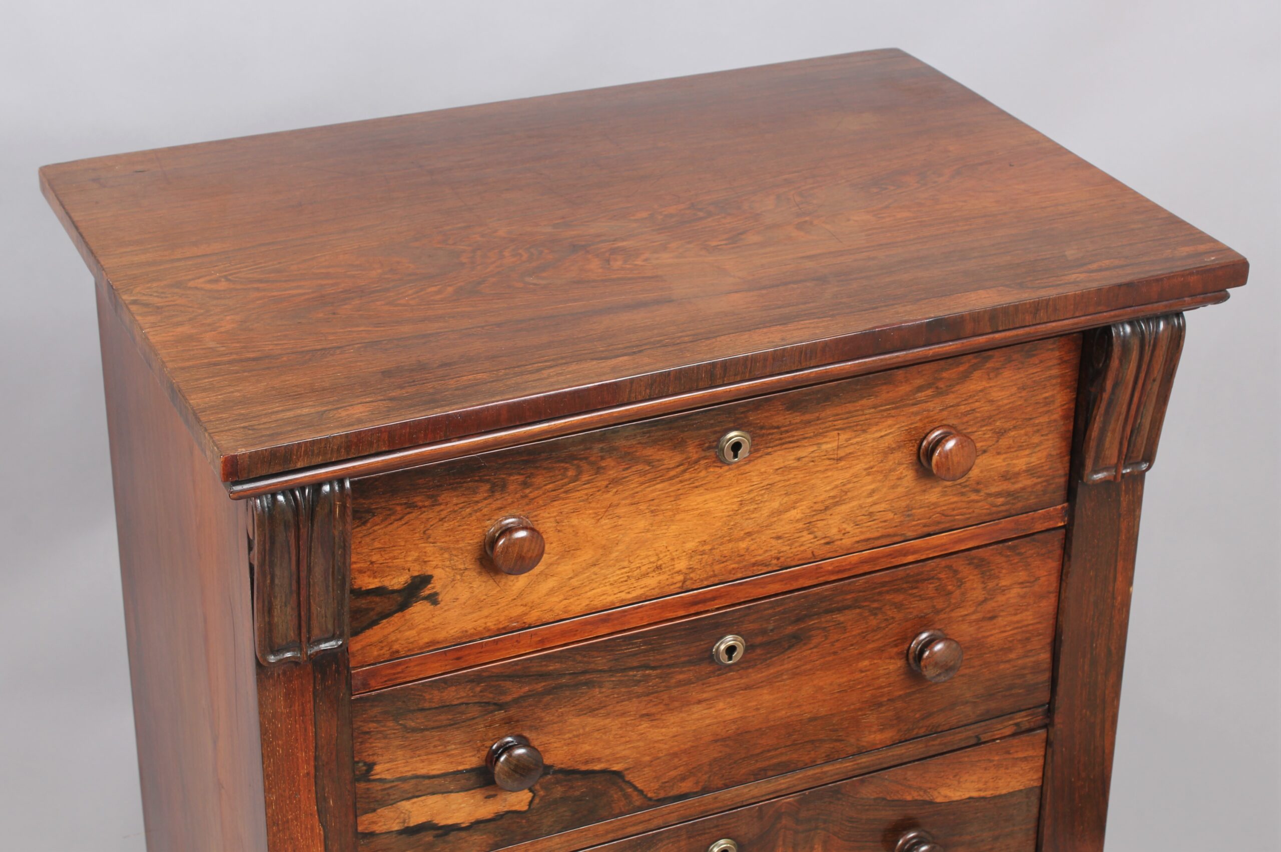 A rosewood Wellington chest