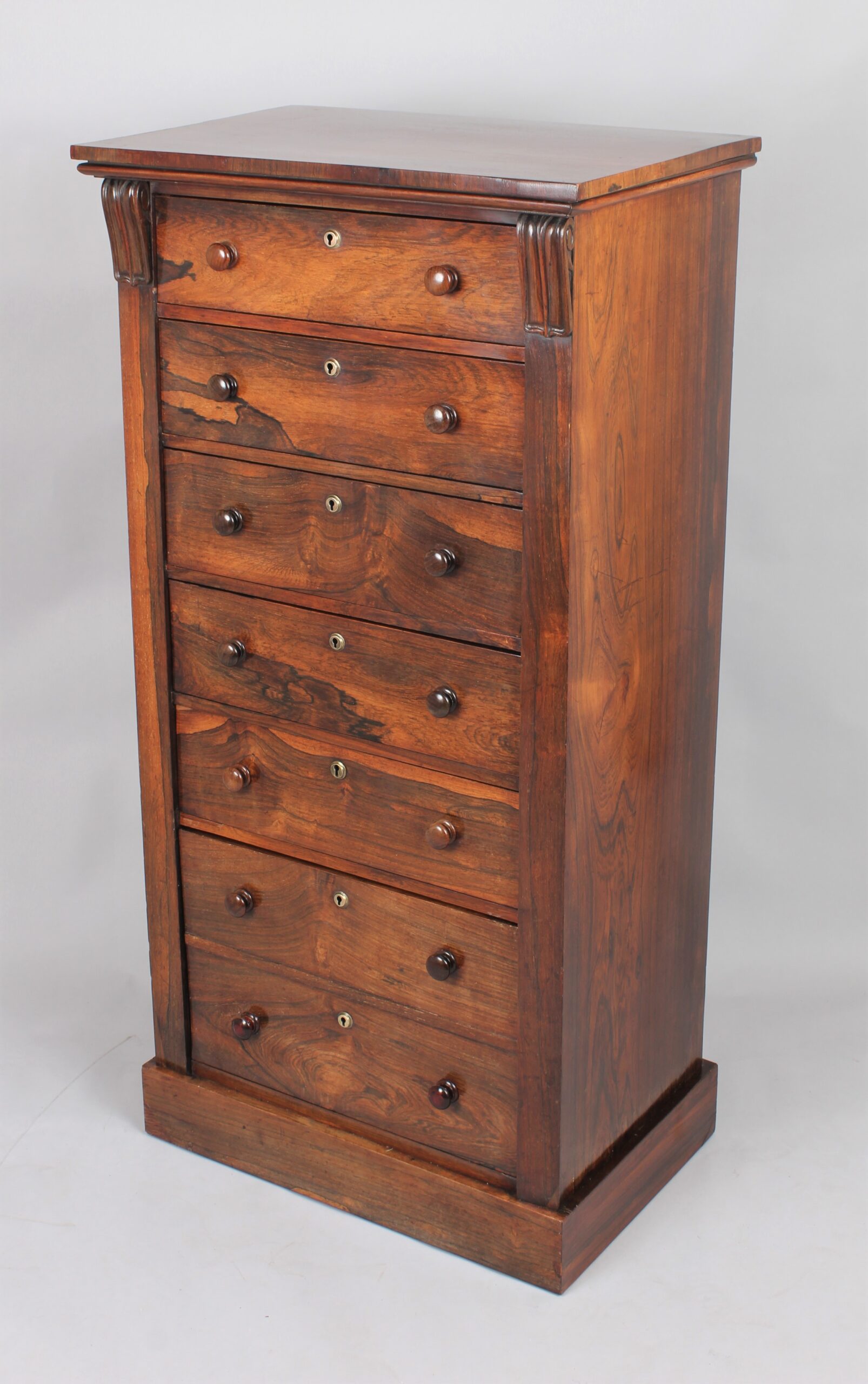 A rosewood Wellington chest