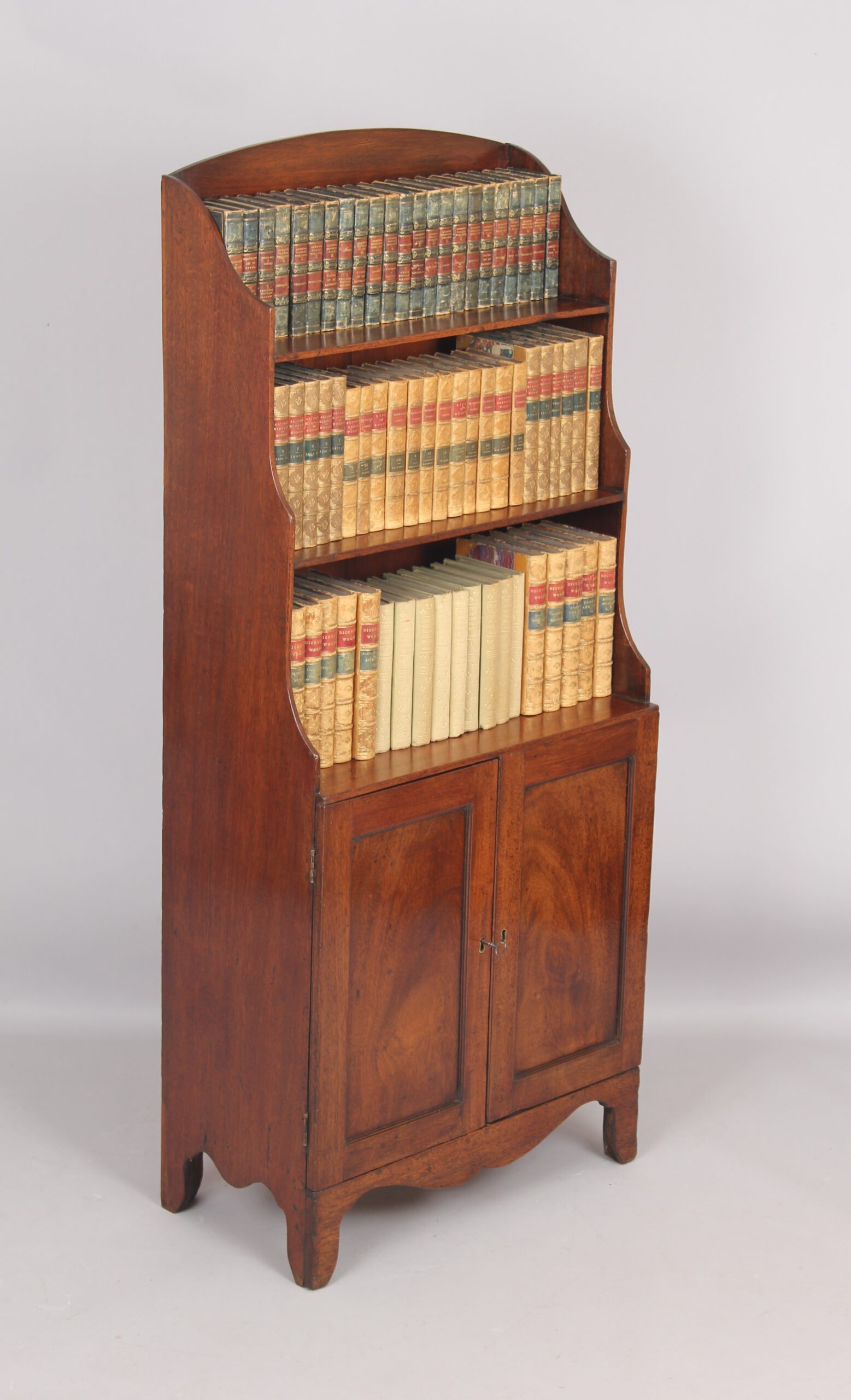 Small mahogany cupboard based waterfall open bookshelves