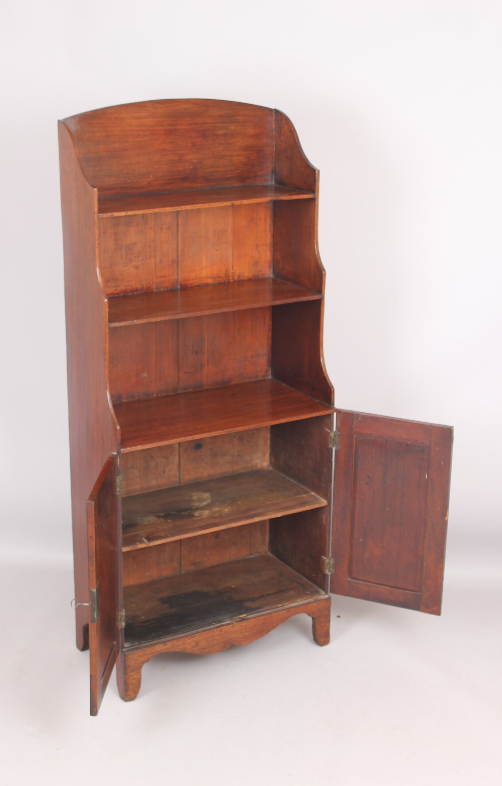 Small mahogany cupboard based waterfall open bookshelves