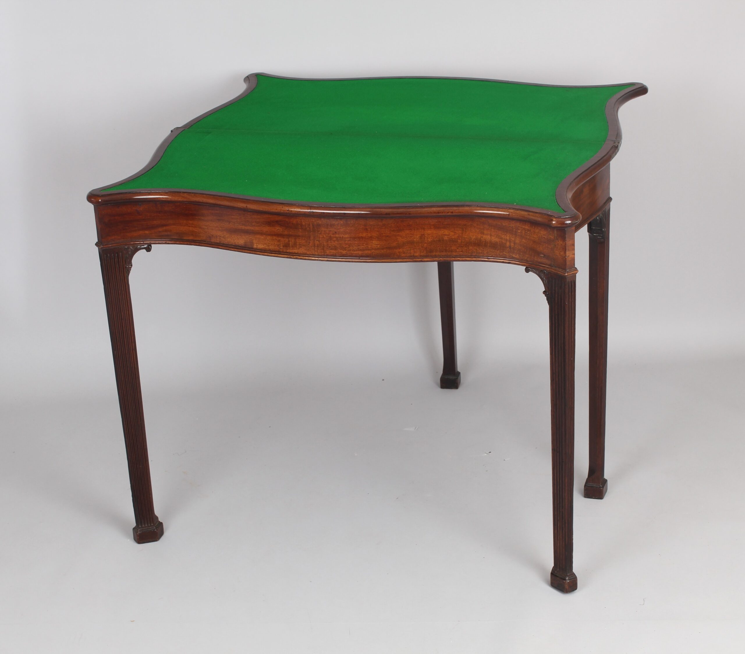 Mahogany serpentine card table