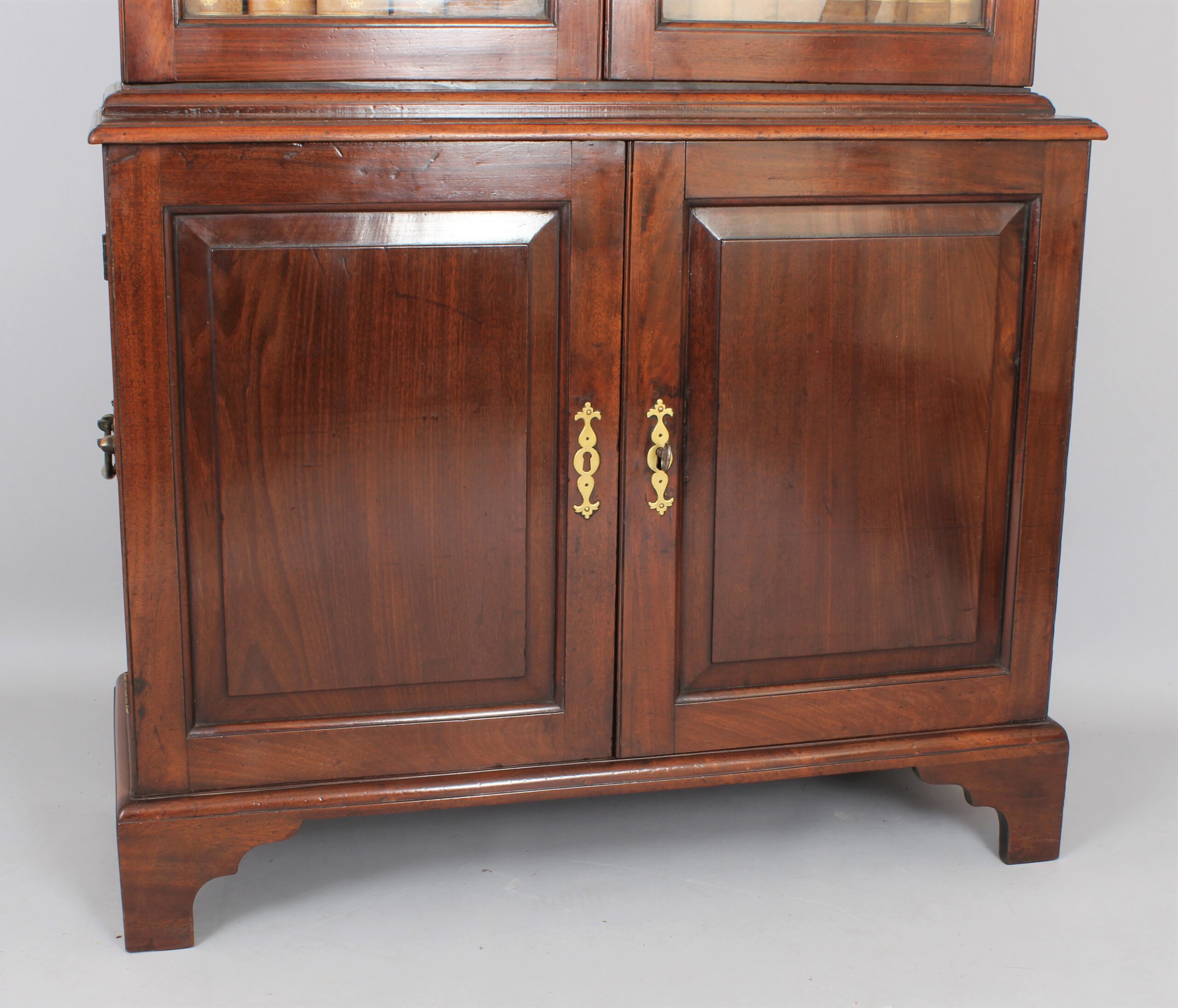 George II ‘red walnut’ cupboard based bookcase