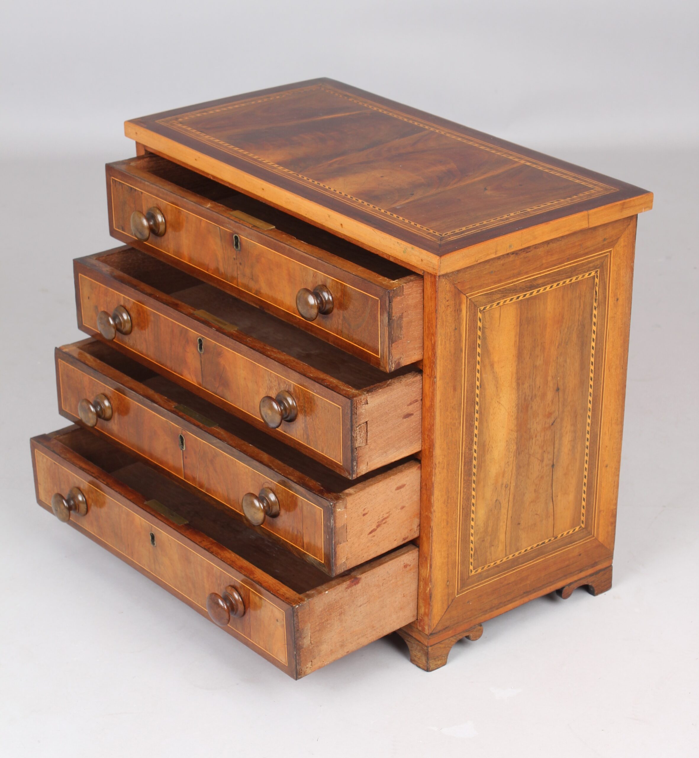 Mid 18th century mahogany miniature chest of four drawers