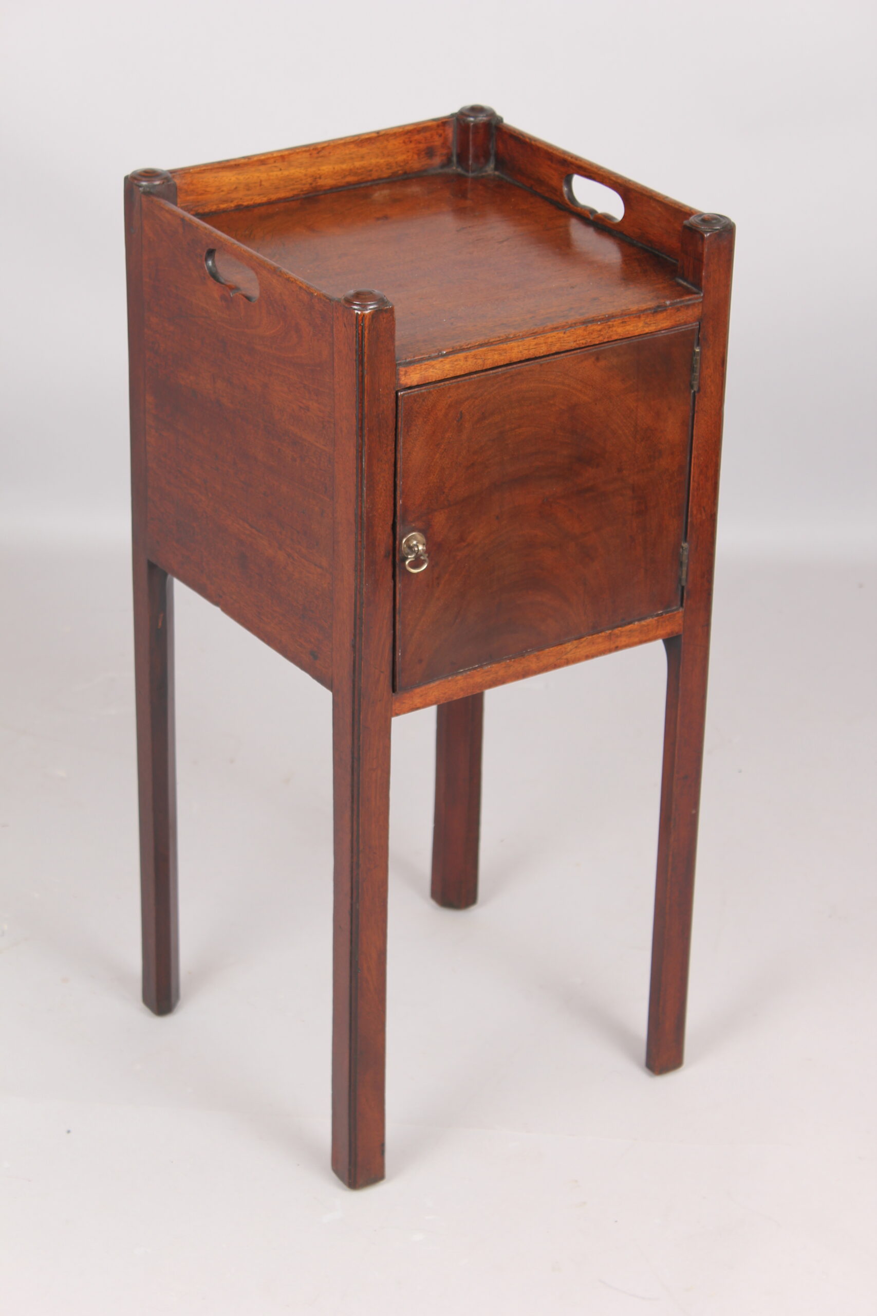 A George III mahogany pot cupboard or bed side table