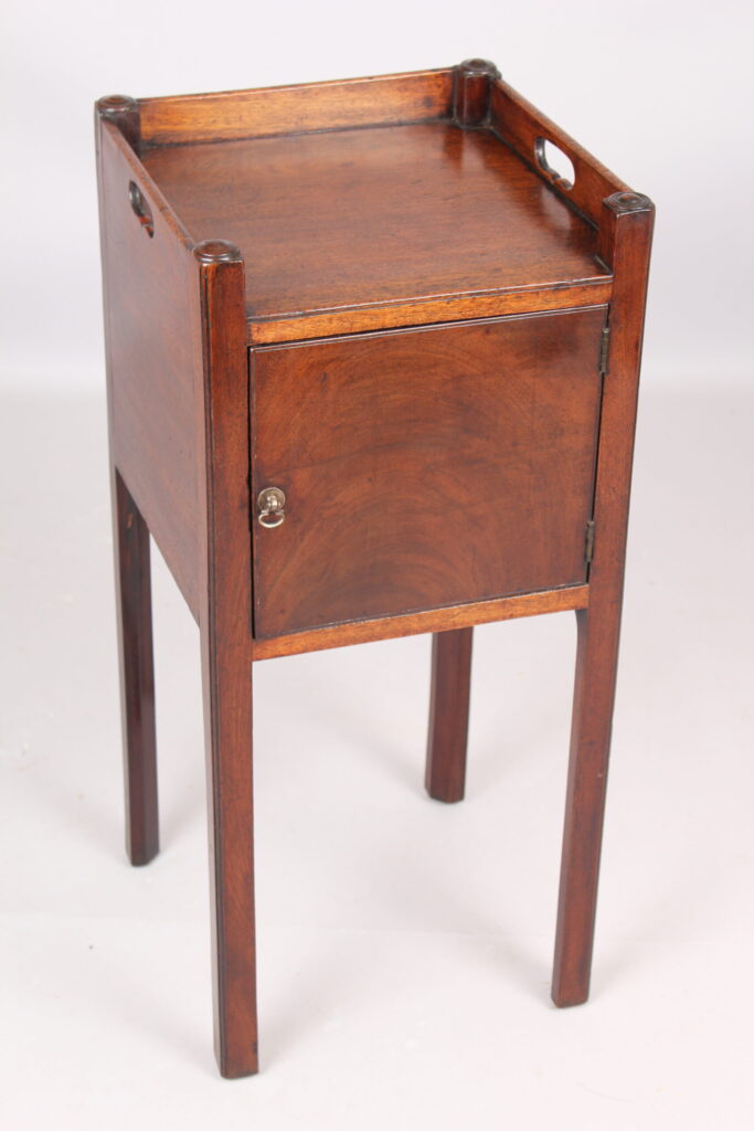 A George III mahogany pot cupboard or bed side table