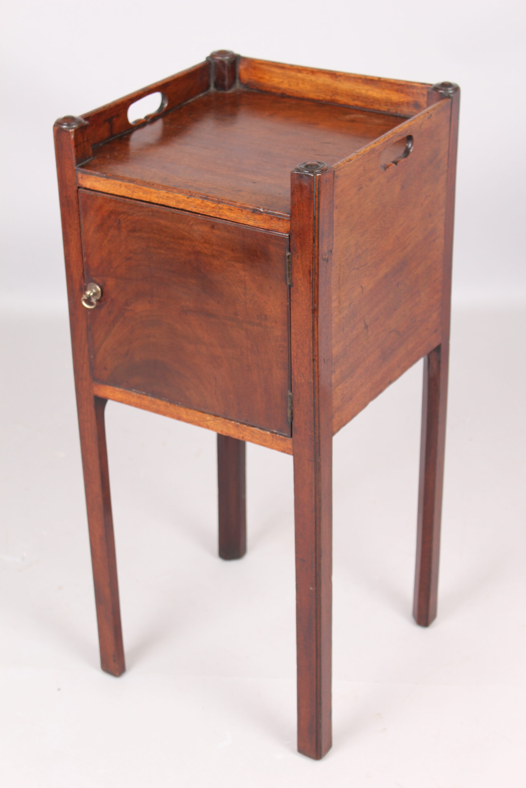 A George III mahogany pot cupboard or bed side table
