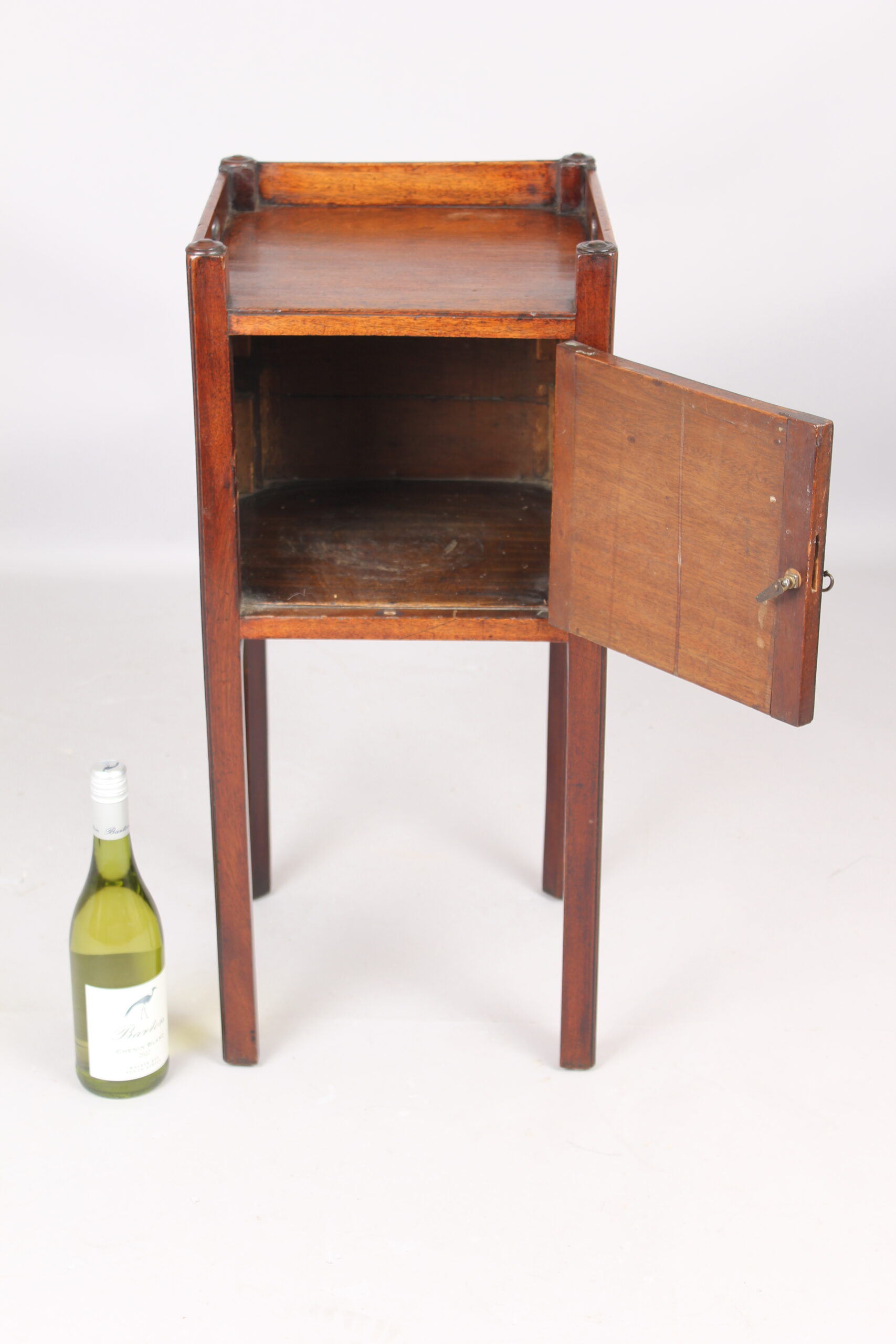 A George III mahogany pot cupboard or bed side table