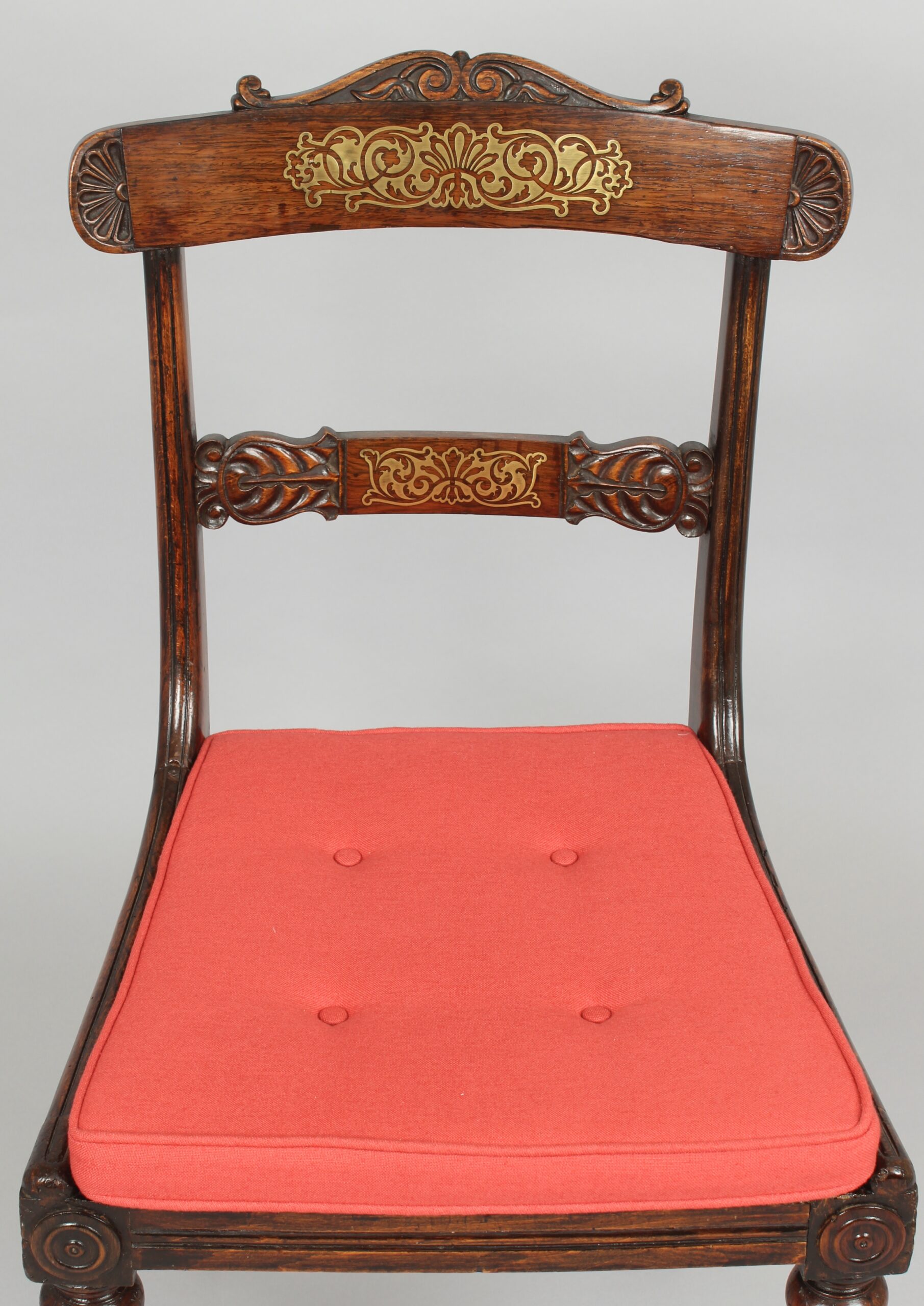 Set of eight Regency period simulated rosewood and brass inlaid chairs