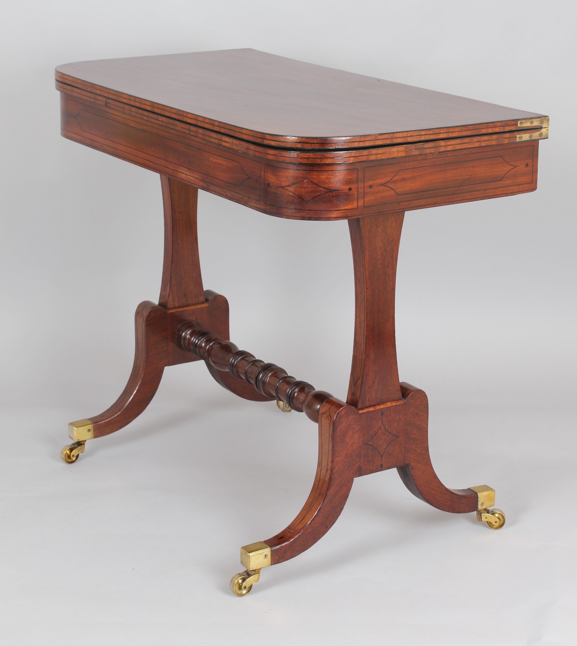 A Regency period mahogany card table