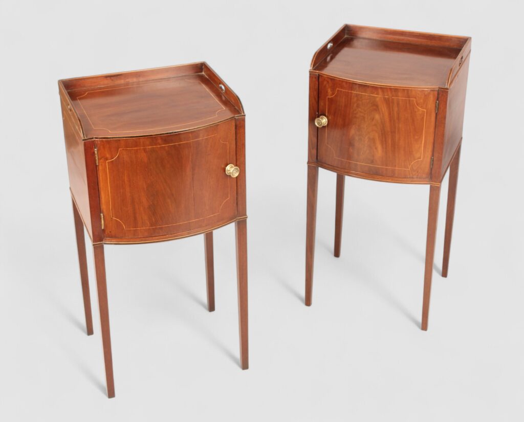 Pair of George III mahogany bow fronted pot cupboards