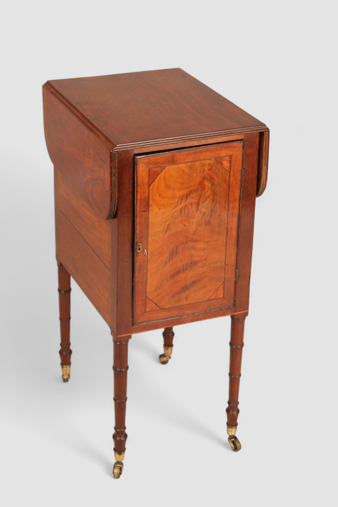 A mahogany drop leaf Pembroke work table