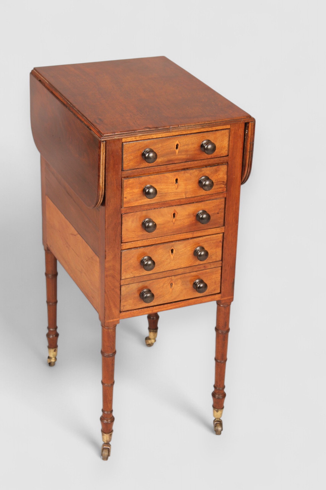 A mahogany drop leaf Pembroke work table