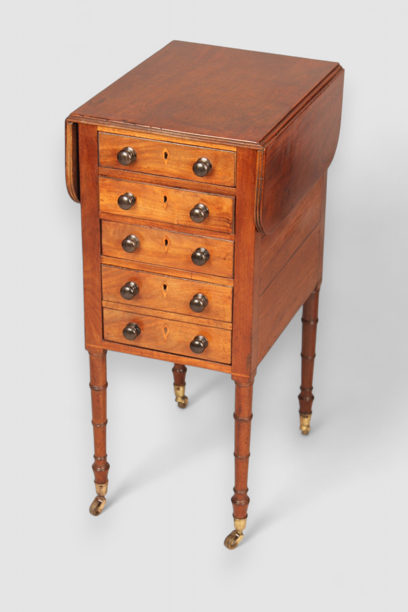 A mahogany drop leaf Pembroke work table