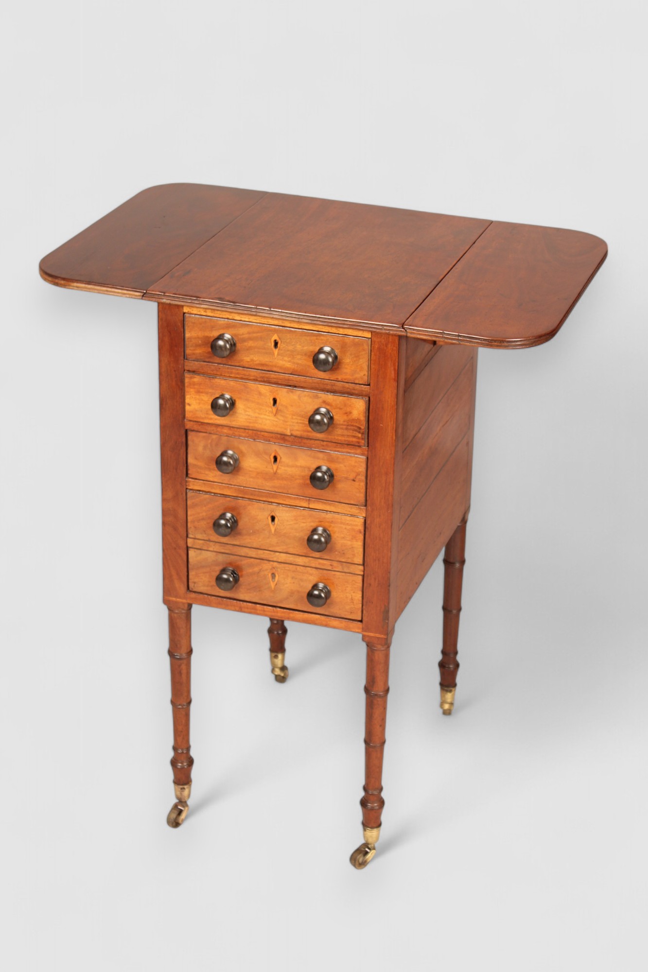 A mahogany drop leaf Pembroke work table
