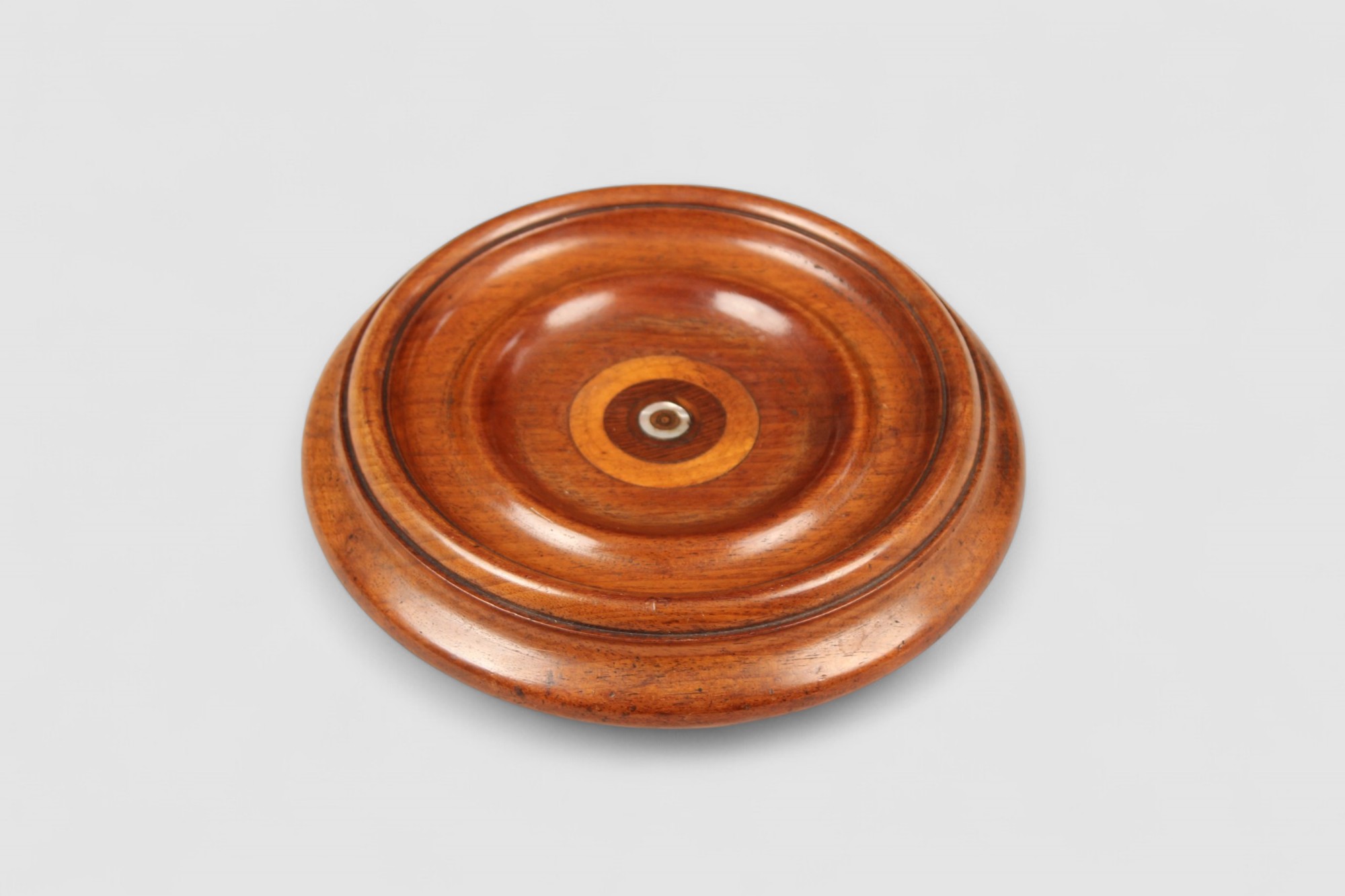 Boldly turned walnut bottle coaster