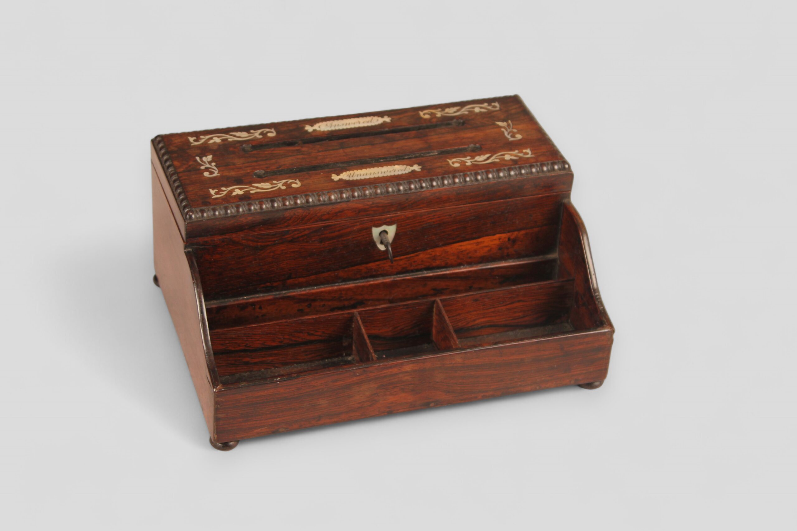 A rosewood correspondence box