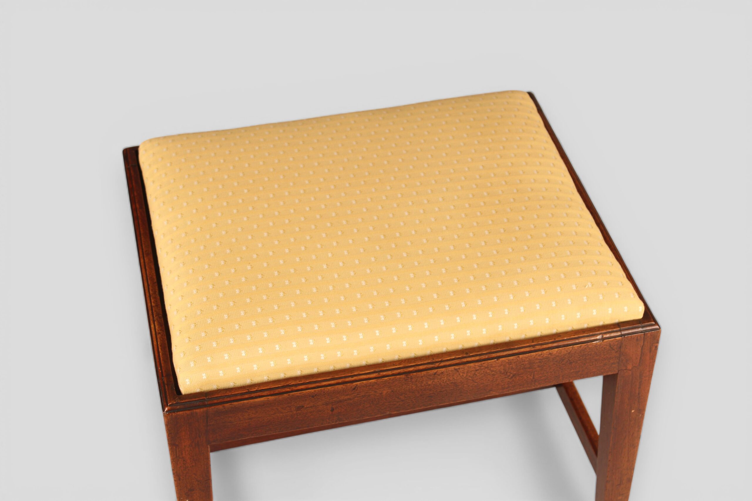 A George III mahogany stool