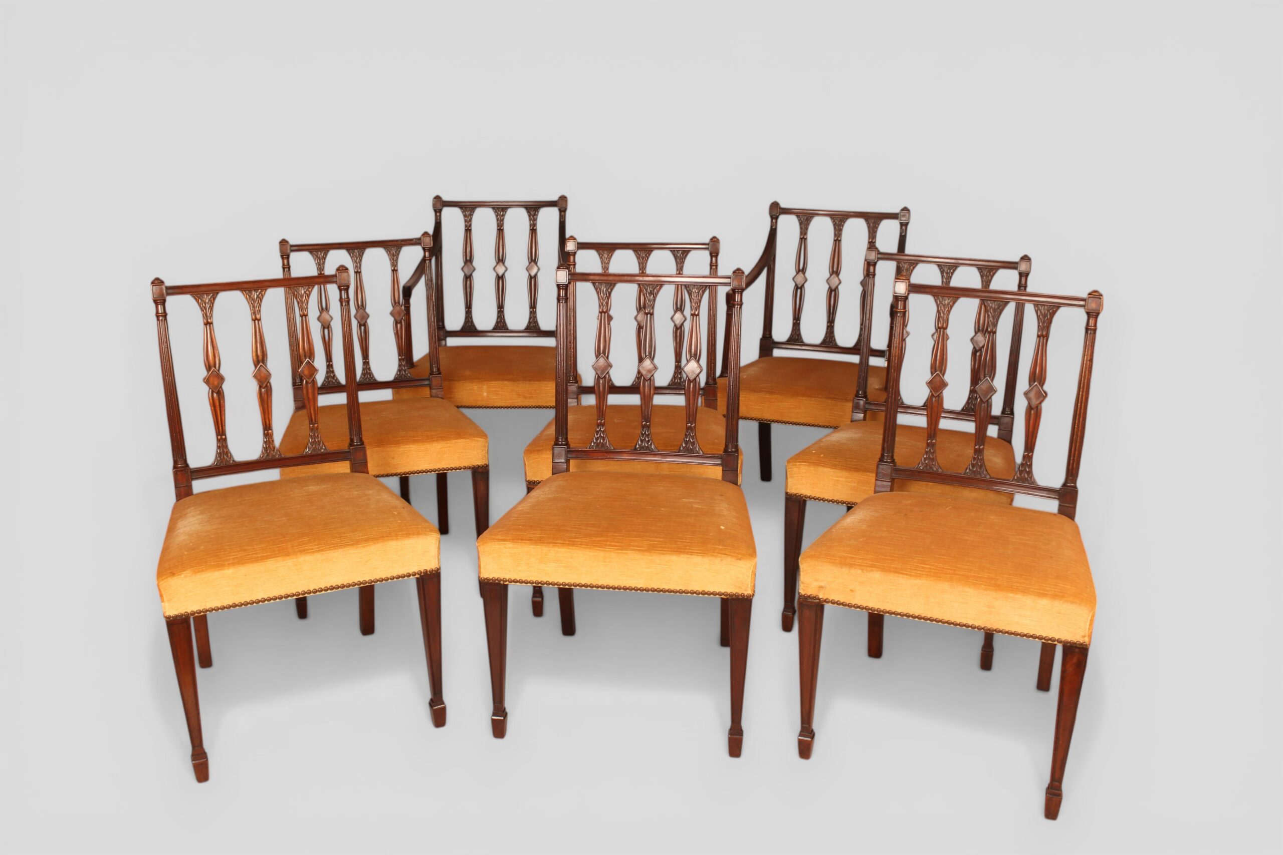 Set of six single and two carvers mahogany dining chairs