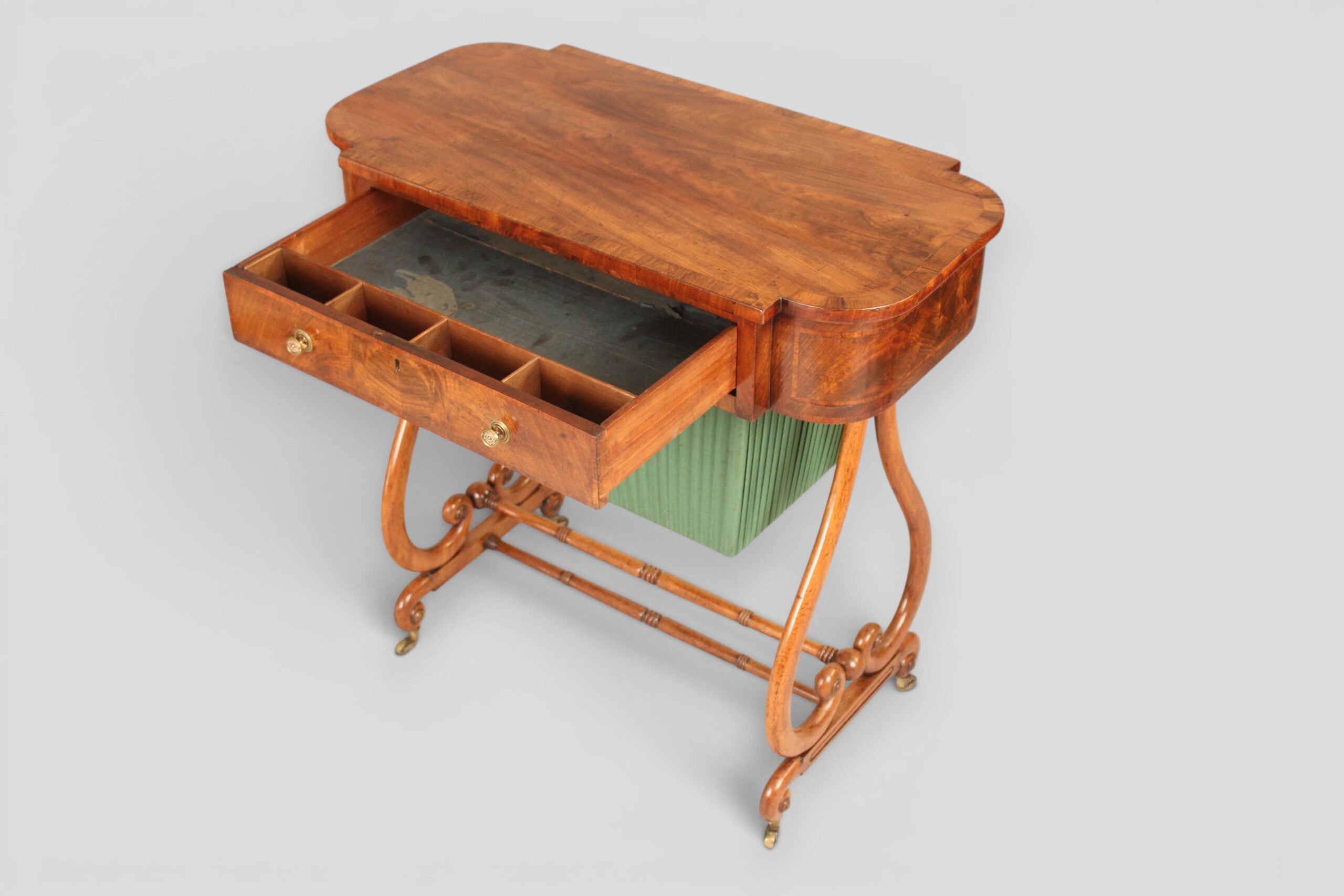 A mahogany lyre-ended work table