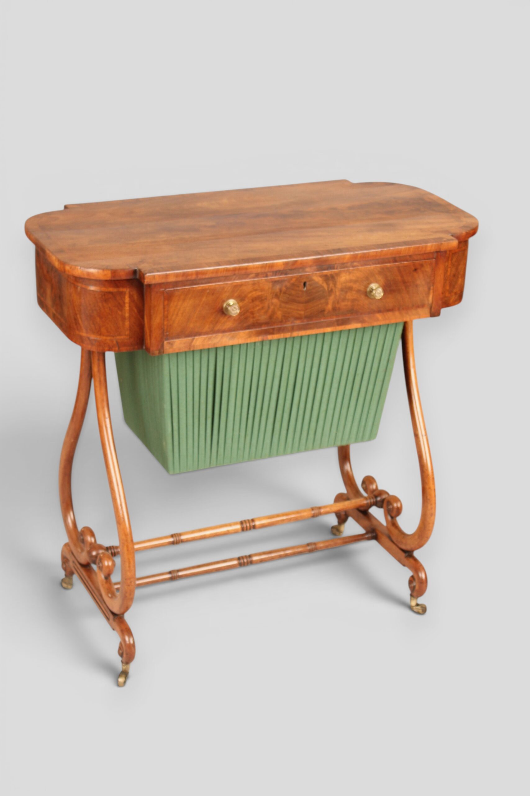 A mahogany lyre-ended work table