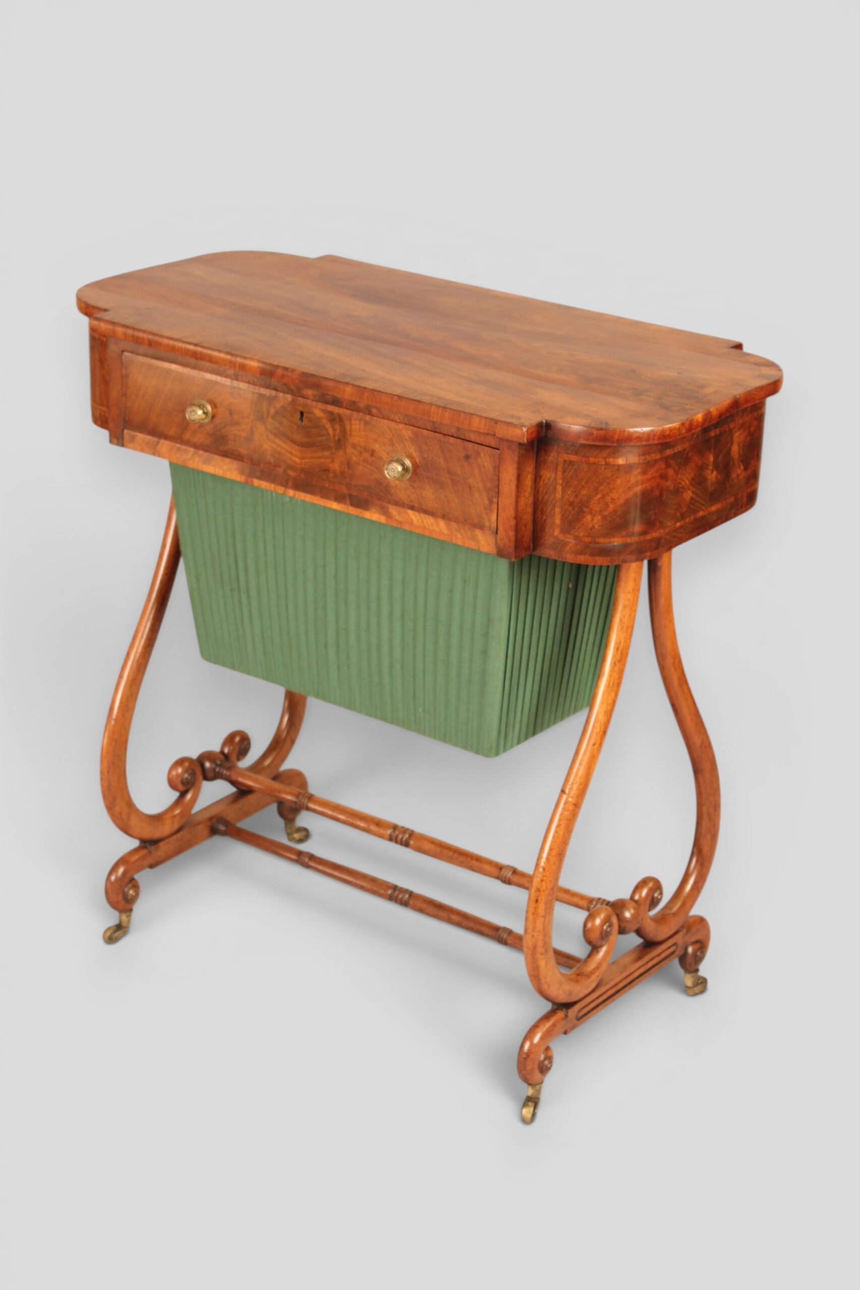 A mahogany lyre-ended work table